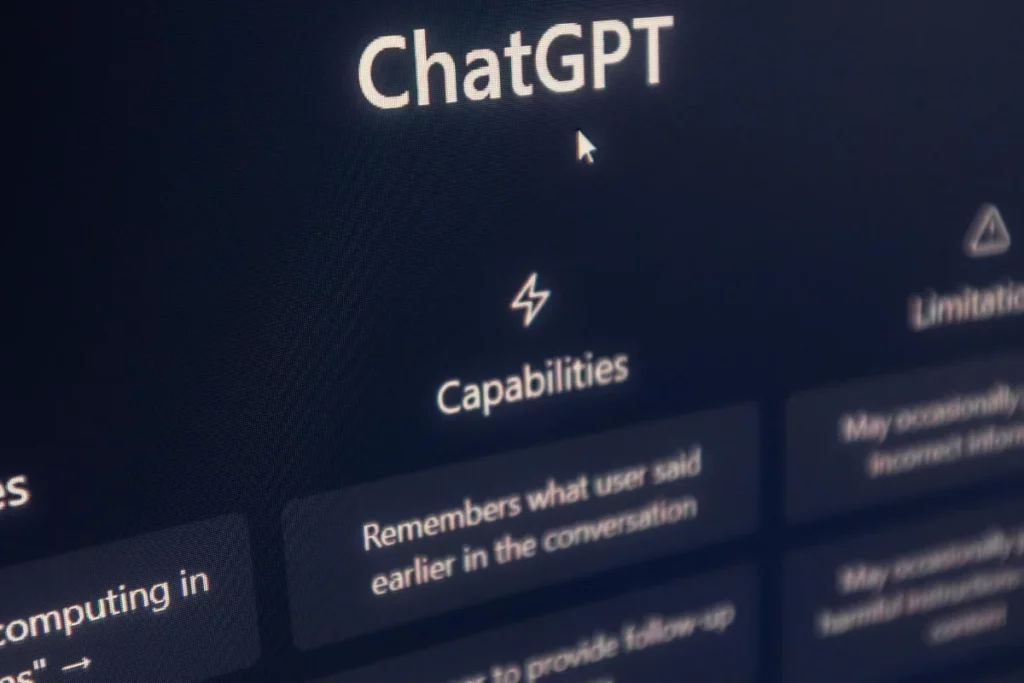 Screen displaying "ChatGPT" with options for capabilities and limitations, including conversation memory and follow-up features.